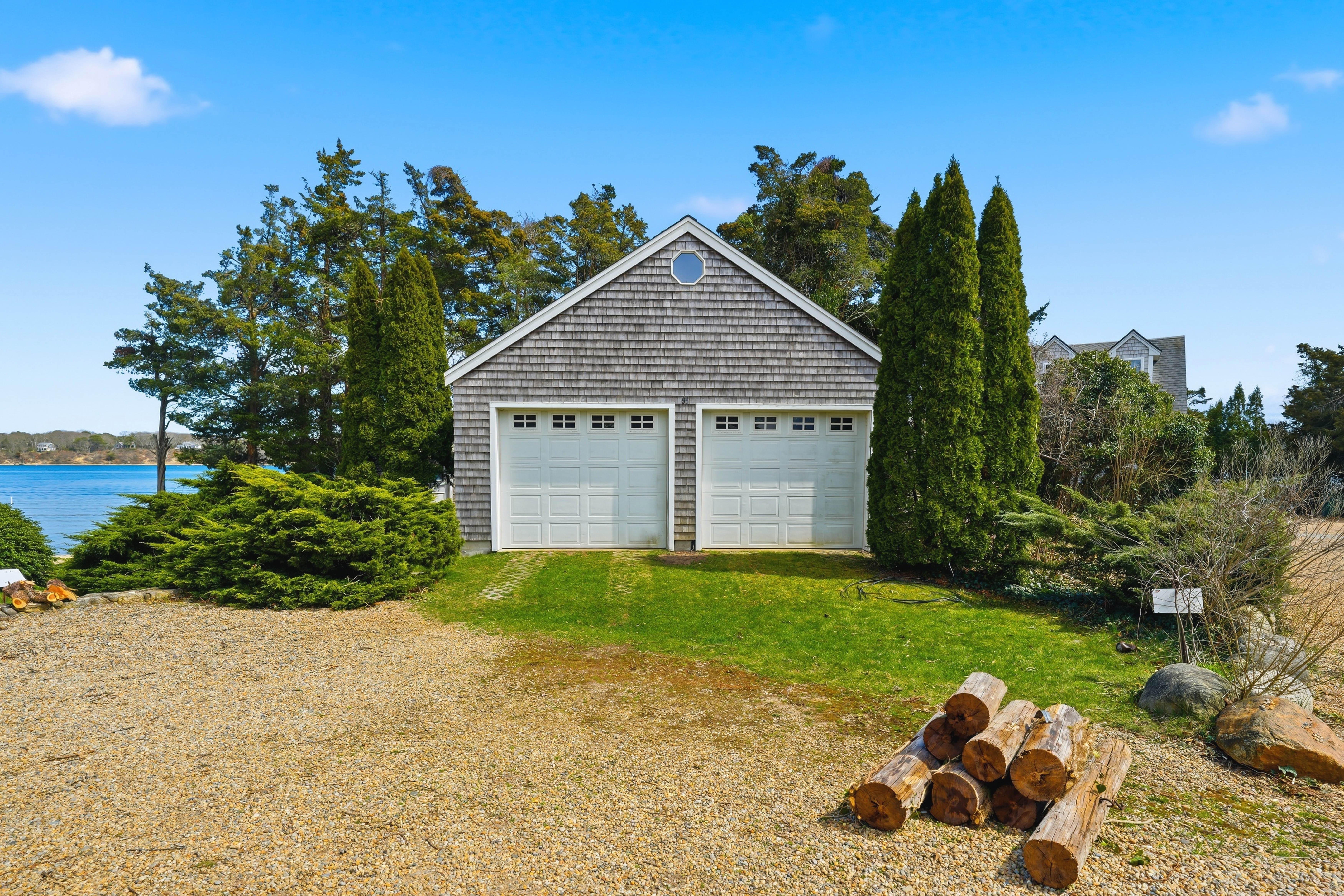 95 Hines Point Road Vineyard Haven, MA 02568 - Photo 35 of 36 a view of a house with a yard and potted plants