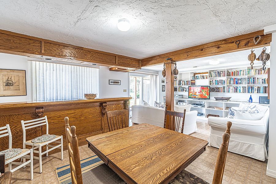 95 Hines Point Road Vineyard Haven, MA 02568 - Photo 37 of 43 a kitchen with a table and chairs in it