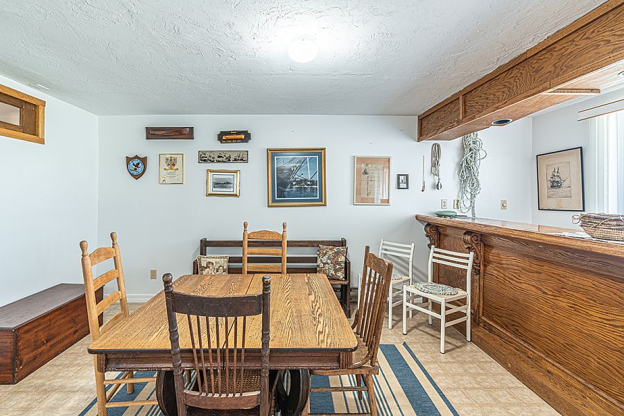 95 Hines Point Road Vineyard Haven, MA 02568 - Photo 38 of 43 a view of a dining room with furniture
