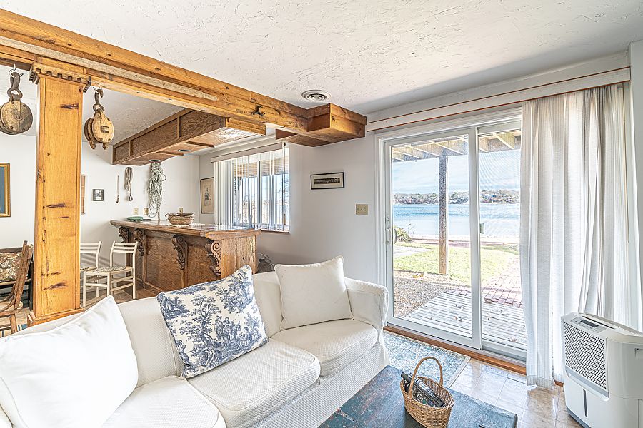 95 Hines Point Road Vineyard Haven, MA 02568 - Photo 39 of 43 a living room with furniture and a floor to ceiling window