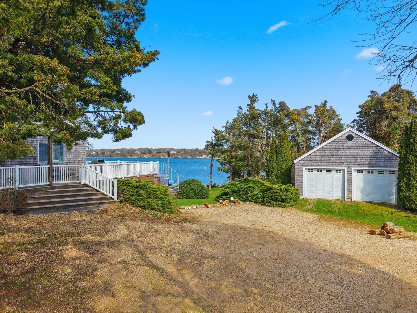 95 Hines Point Road Vineyard Haven, MA 02568 - Photo 4 of 36 a front view of a house with a yard