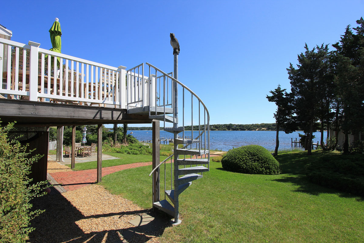 95 Hines Point Road Vineyard Haven, MA 02568 - Photo 4 of 43 a view of a chair and tables in the patio