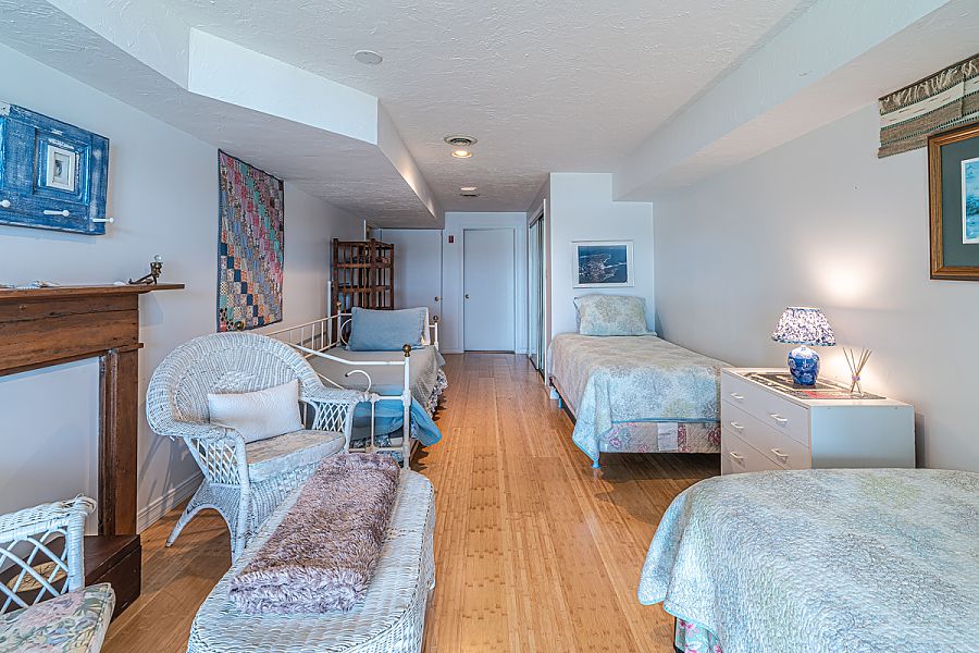 95 Hines Point Road Vineyard Haven, MA 02568 - Photo 42 of 43 a bedroom with furniture and a wooden floor