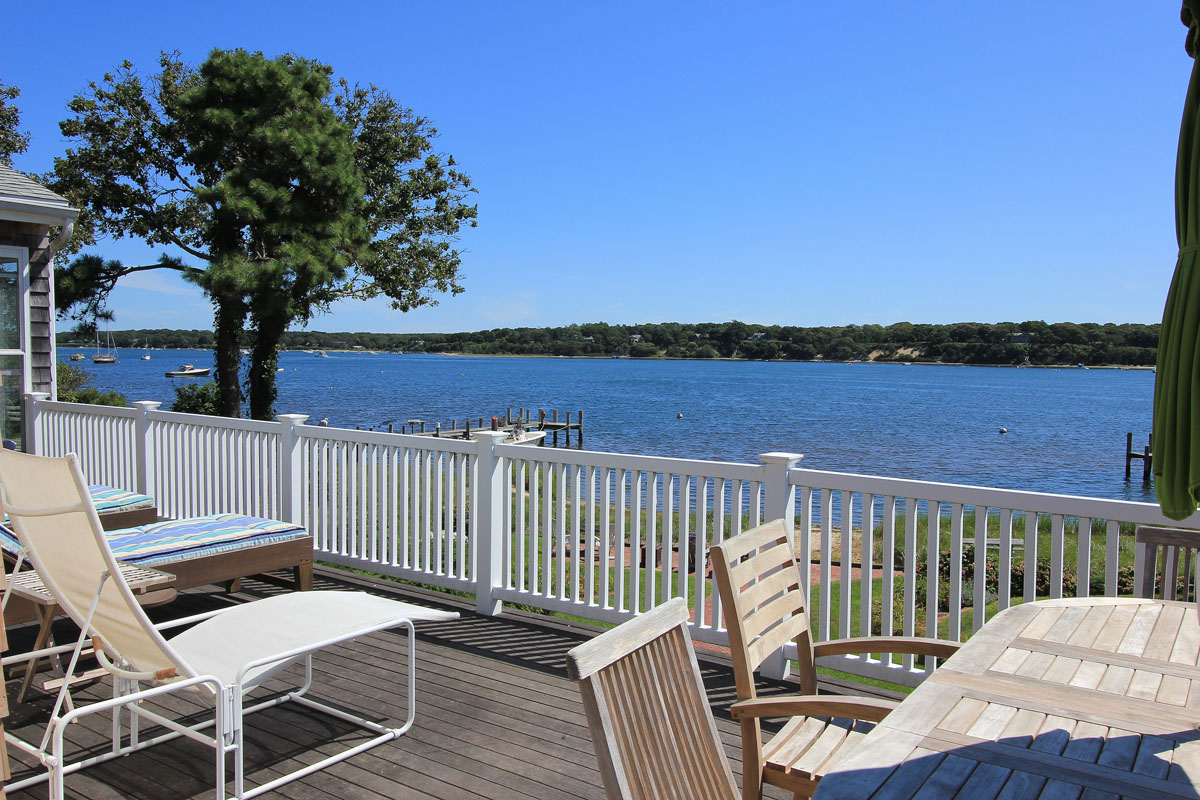 95 Hines Point Road Vineyard Haven, MA 02568 - Photo 7 of 43 a view of a balcony with wooden floor and lake view