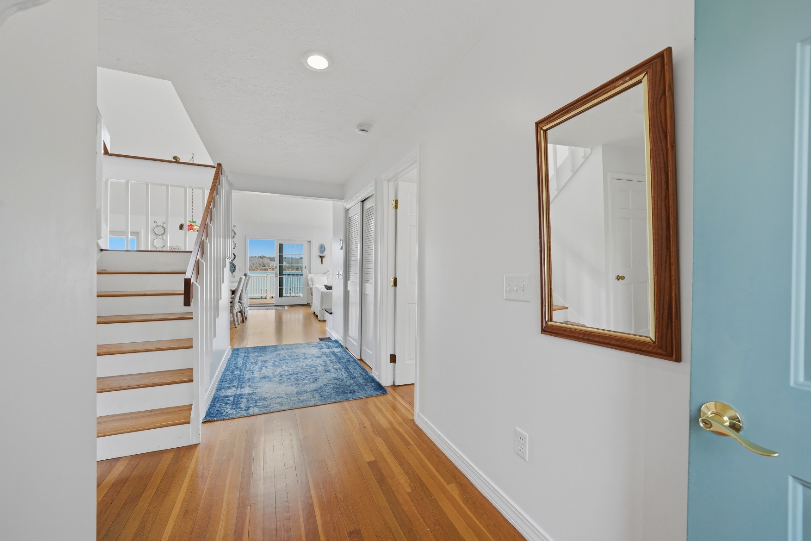 95 Hines Point Road Vineyard Haven, MA 02568 - Photo 8 of 36 a view of a hallway with wooden floor and entryway