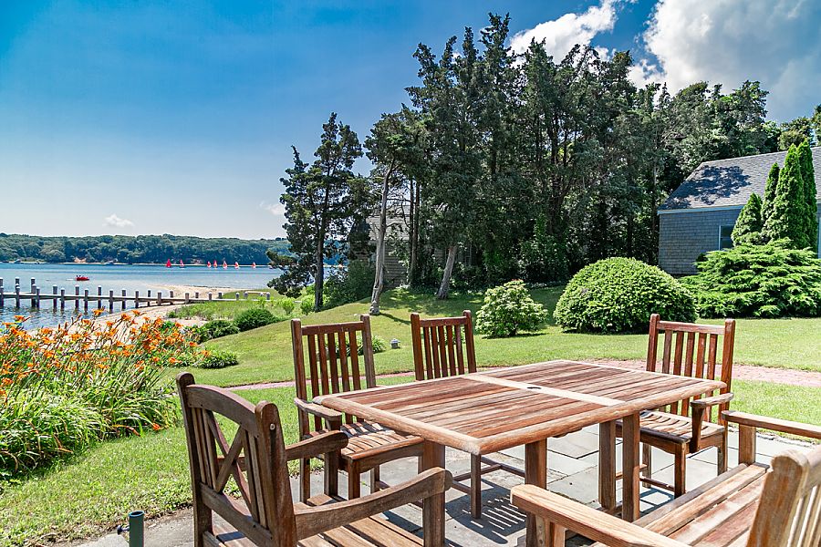 95 Hines Point Road Vineyard Haven, MA 02568 - Photo 9 of 43 a view of a dinning table and chairs on the deck
