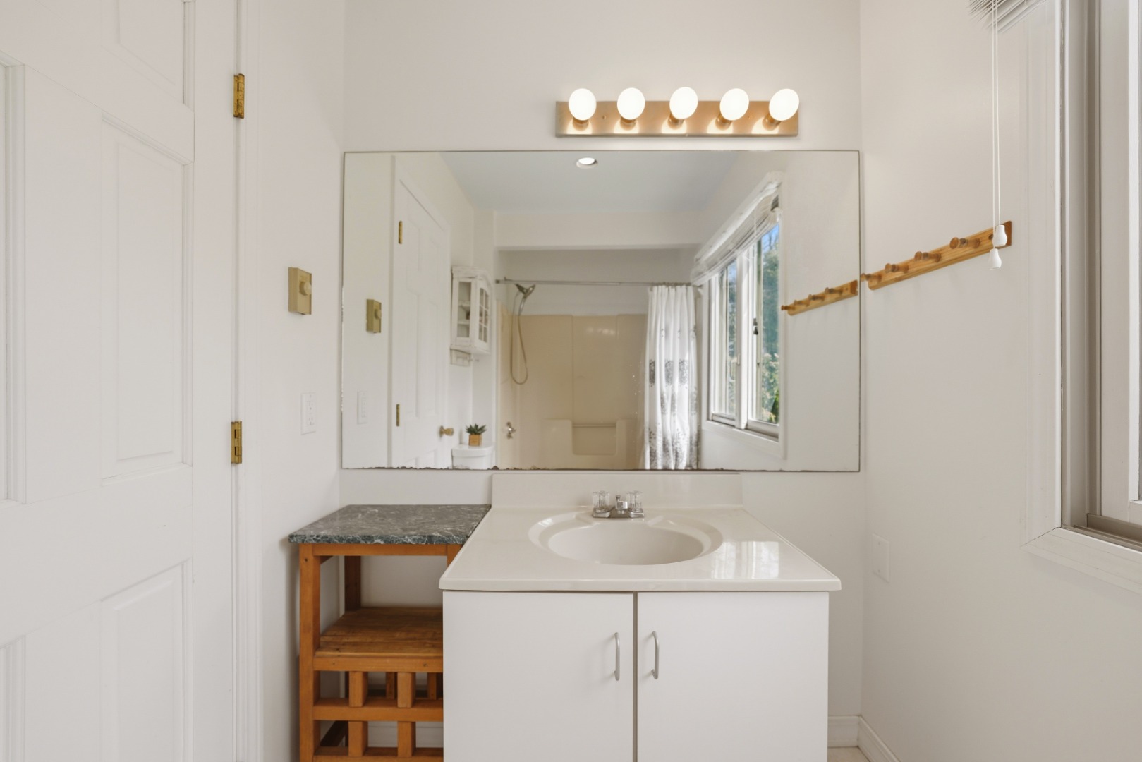 95 Hines Point Road Vineyard Haven, MA 02568 - Photo 10 of 36 a bathroom with a sink and a mirror