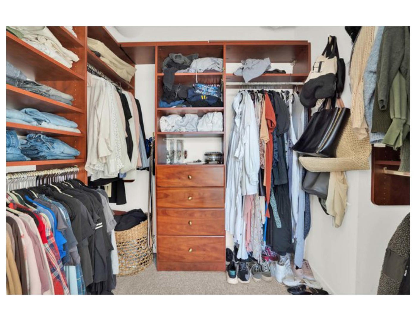 909 West Washington Boulevard, Unit 1002 Chicago, IL 60607 - Photo 15 of 15 a view of walk in closet with clothes and shoes