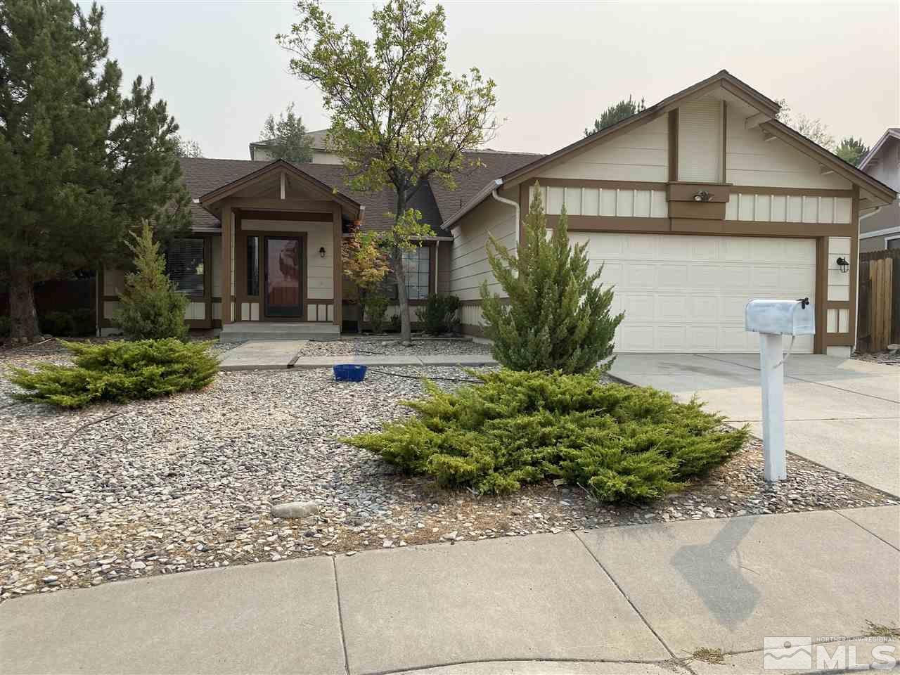 5236 Simons Drive Reno, NV 89523 - Photo 1 of 19 a front view of a house with garden