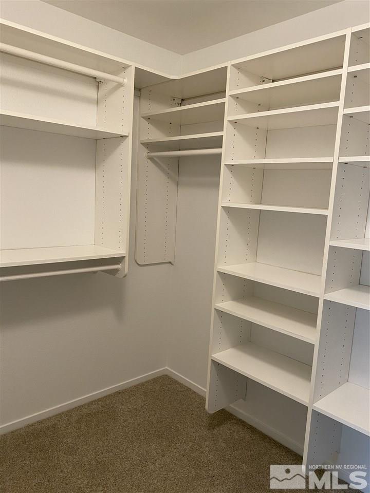5236 Simons Drive Reno, NV 89523 - Photo 13 of 19 a view of walk in closet with empty racks