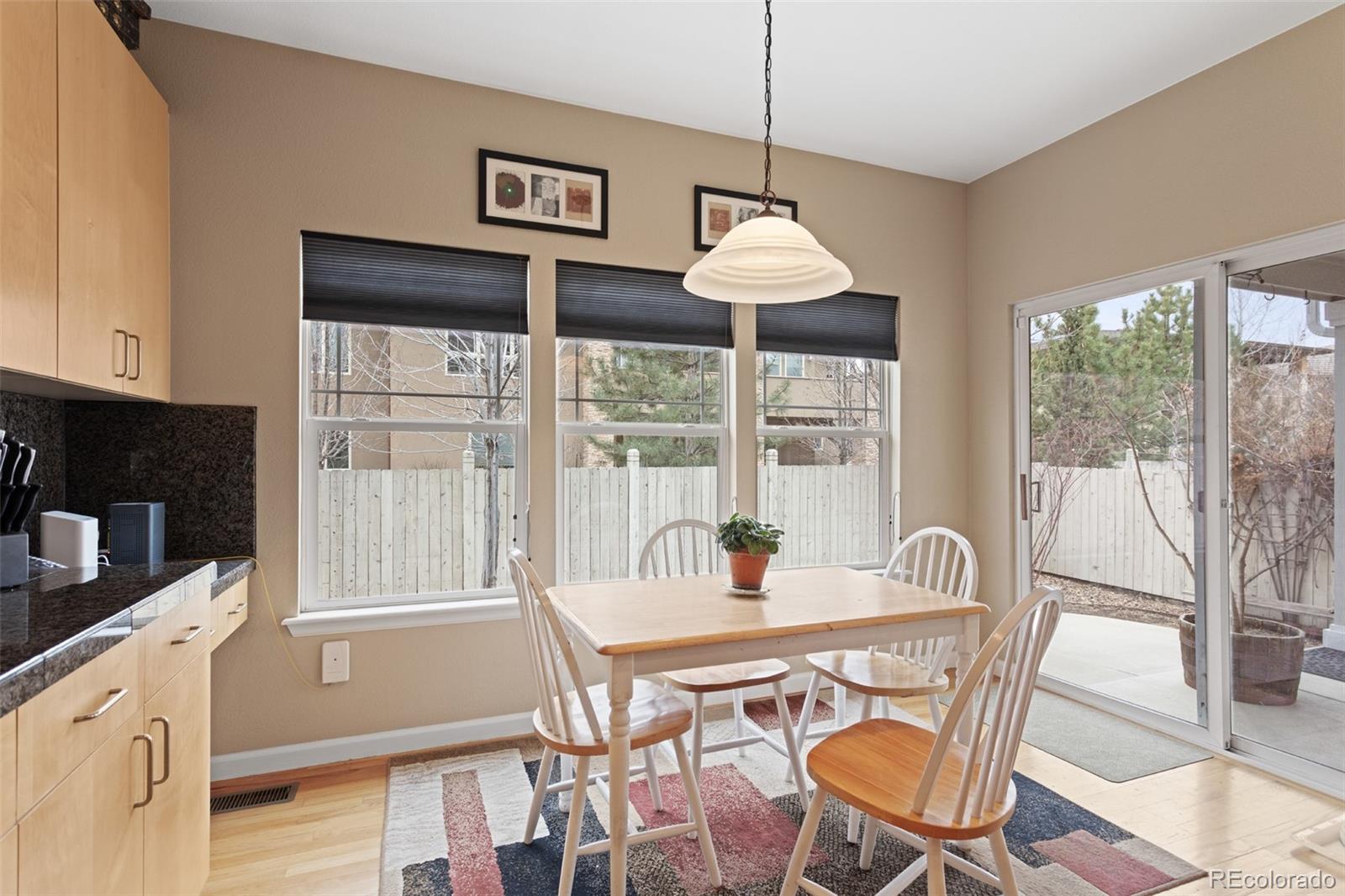 4207 Frederick Circle Longmont, CO 80503 - Photo 12 of 35 a view of a dining room with furniture window and outside view
