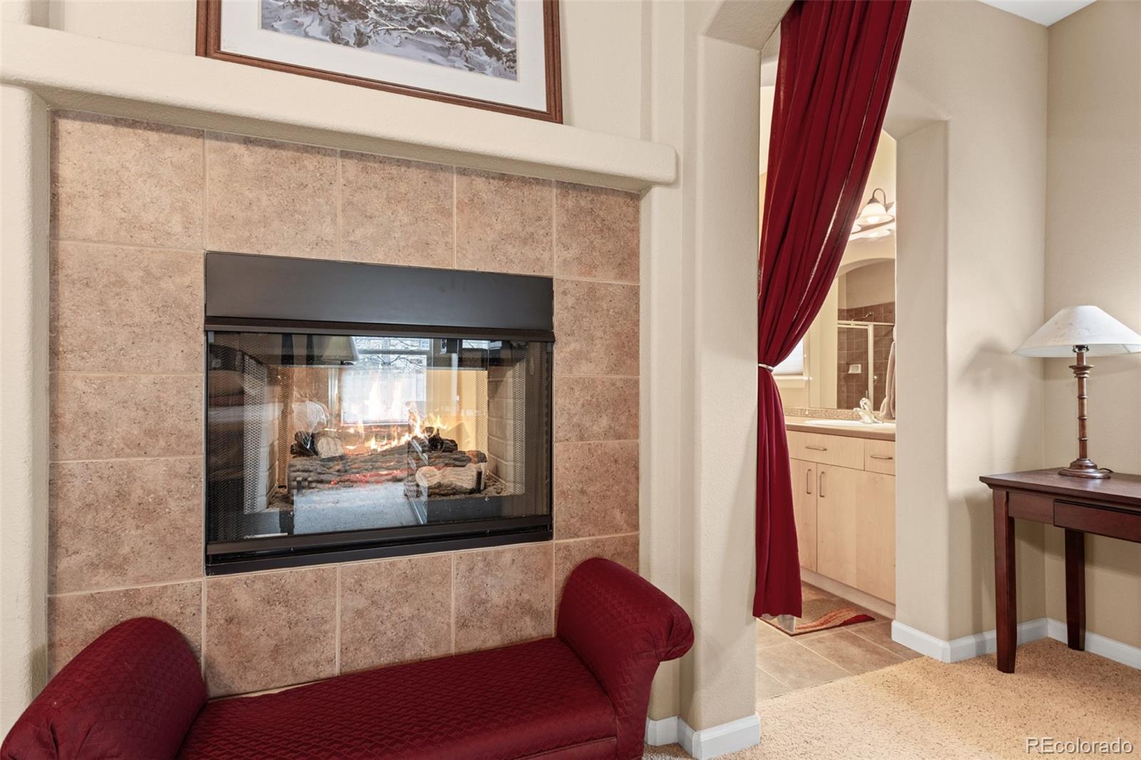 4207 Frederick Circle Longmont, CO 80503 - Photo 17 of 35 a living room with furniture and a fireplace