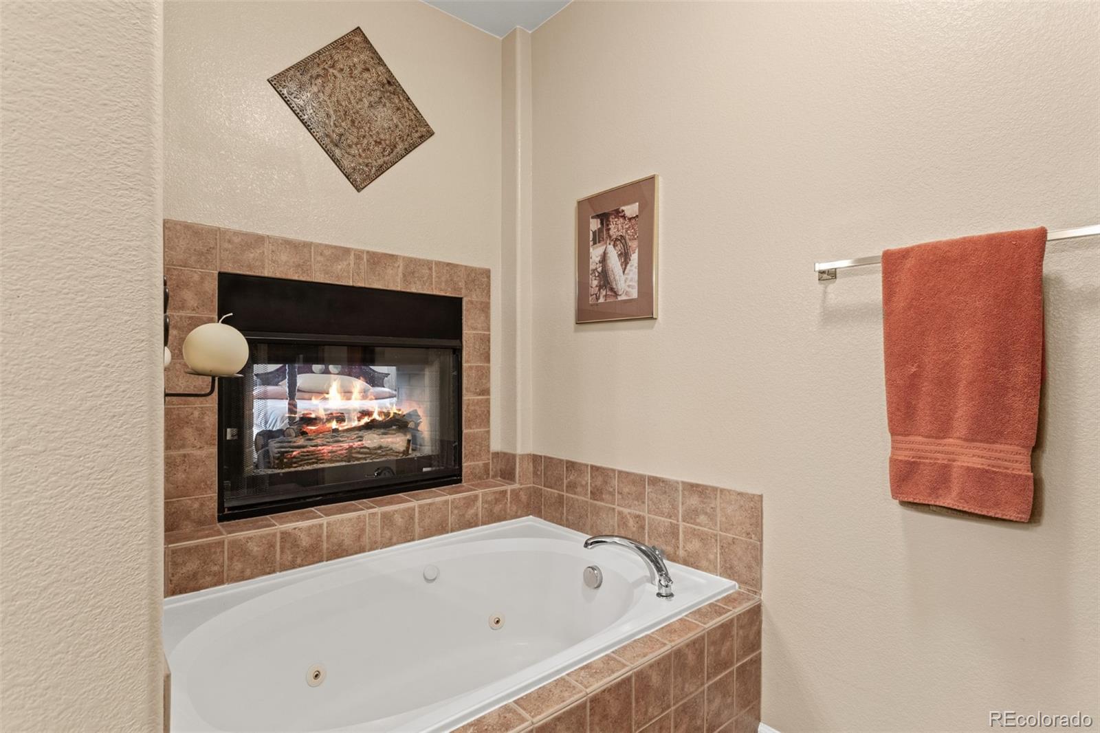 4207 Frederick Circle Longmont, CO 80503 - Photo 20 of 35 a bathroom with a bathtub and a fire place