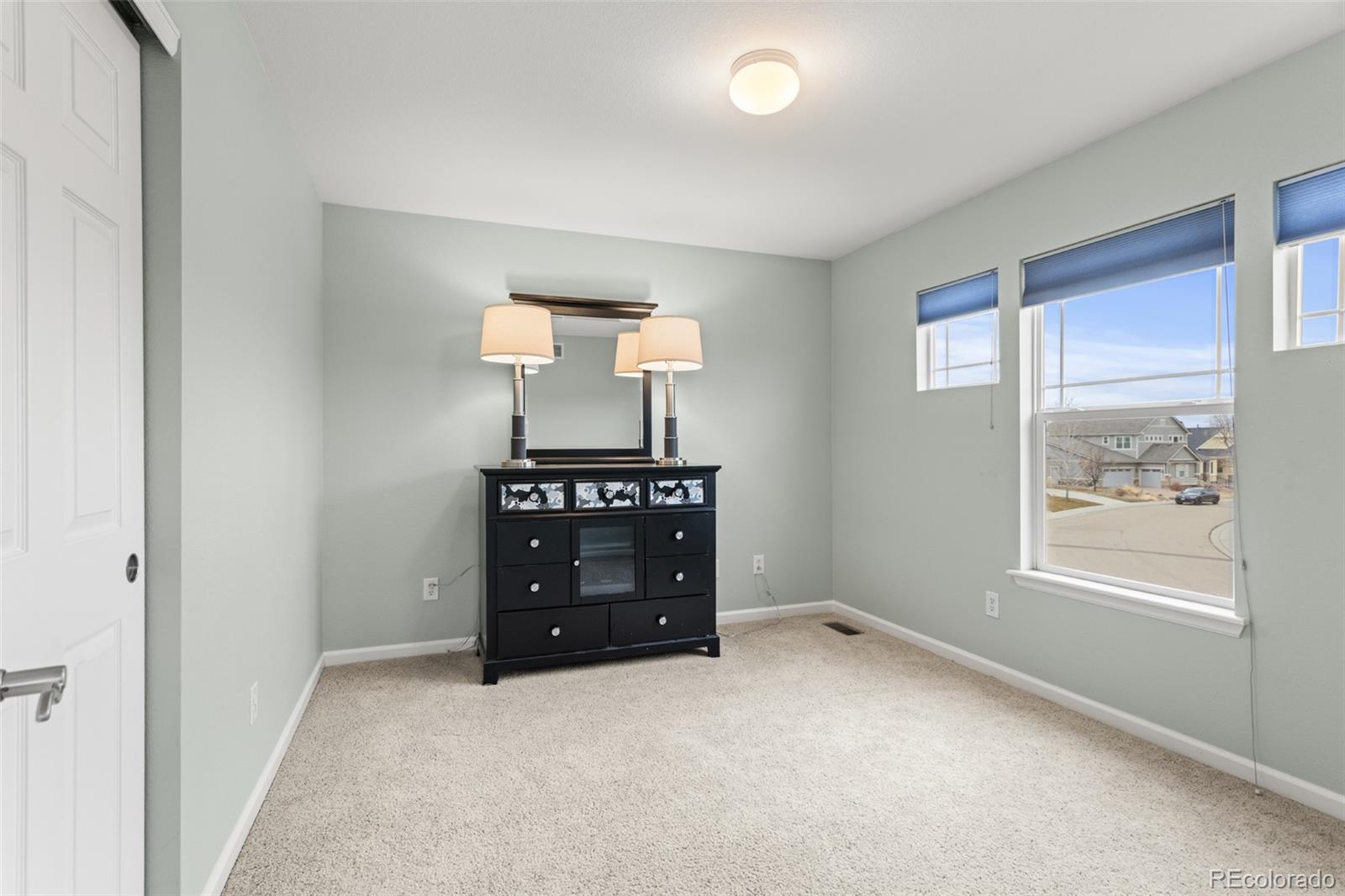 4207 Frederick Circle Longmont, CO 80503 - Photo 25 of 35 wooden floor and window in a room