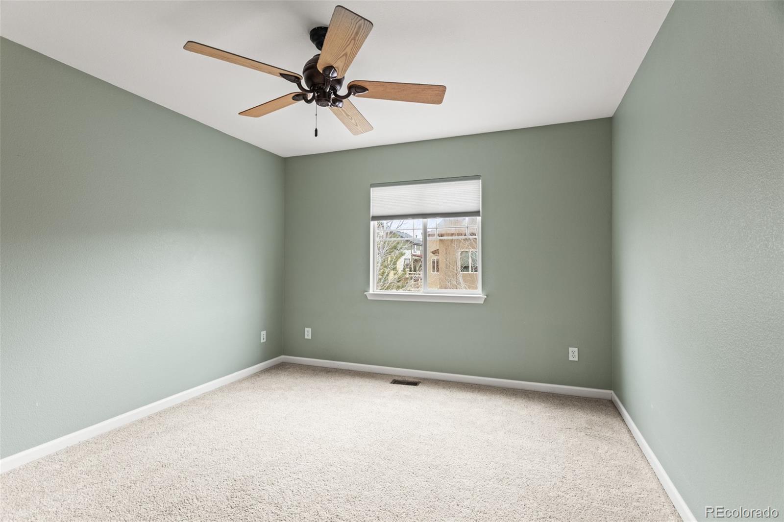 4207 Frederick Circle Longmont, CO 80503 - Photo 26 of 35 an empty room with a window and a fan