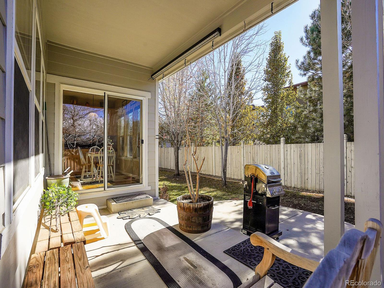 4207 Frederick Circle Longmont, CO 80503 - Photo 27 of 35 a view of a patio with couches chairs and wooden floor