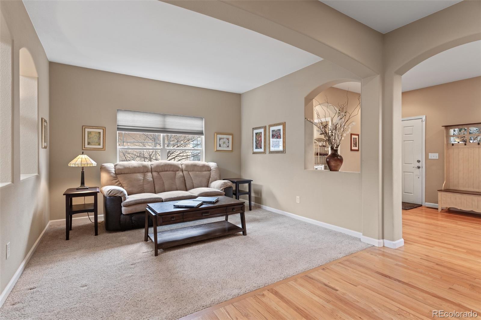 4207 Frederick Circle Longmont, CO 80503 - Photo 3 of 35 a living room with furniture and a wooden floor