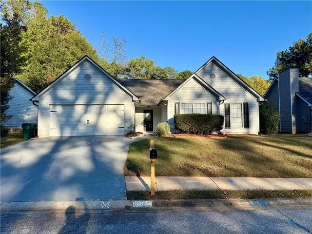 a view of multiple houses with a street