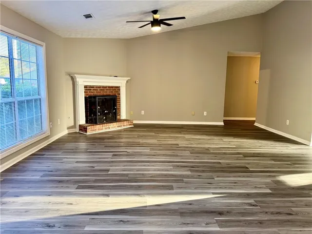a view of kitchen with wooden floor
