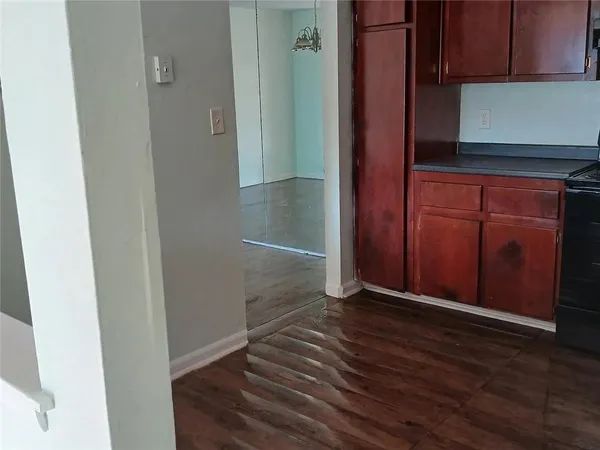 an empty room with wooden floor