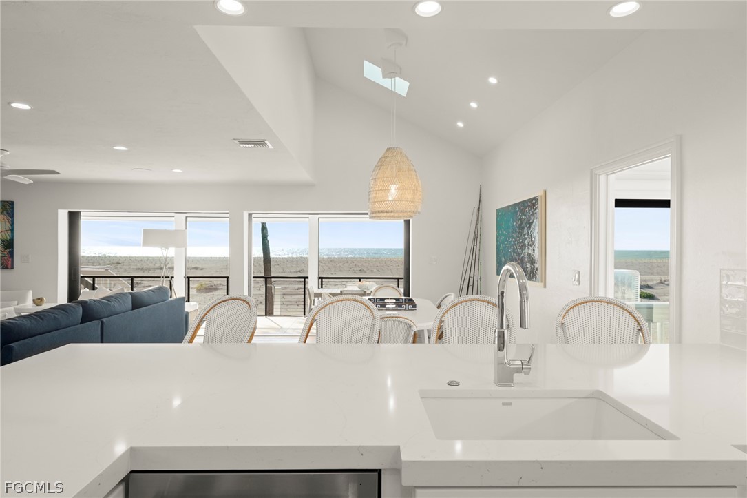 19 Beach Homes Captiva, FL 33924 - Photo 11 of 49 a large white kitchen with a large window