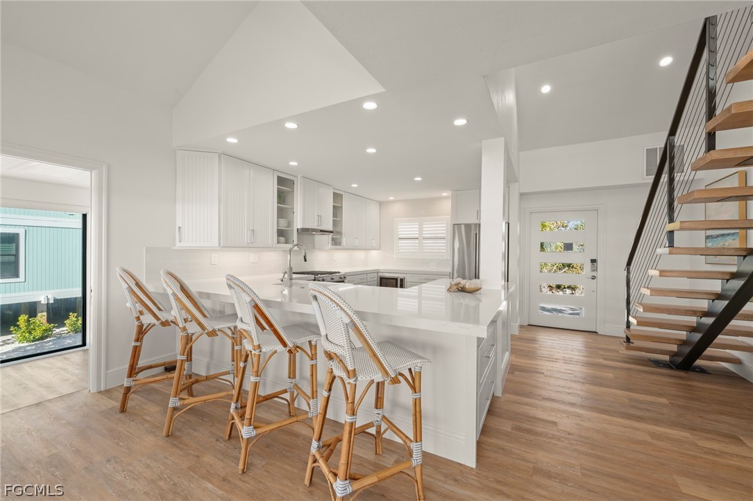 19 Beach Homes Captiva, FL 33924 - Photo 12 of 49 a large kitchen with a table and chairs