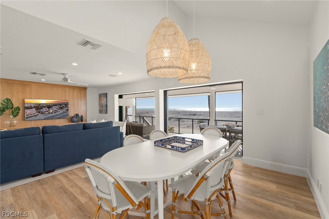 19 Beach Homes Captiva, FL 33924 - Photo 14 of 49 a kitchen with a table and chairs in it