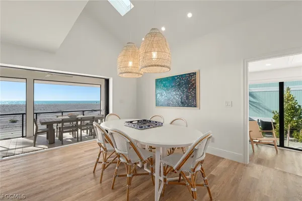 a dining room with furniture and wooden floor