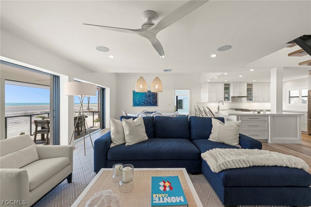 19 Beach Homes Captiva, FL 33924 - Photo 18 of 49 a living room with furniture and a view of kitchen