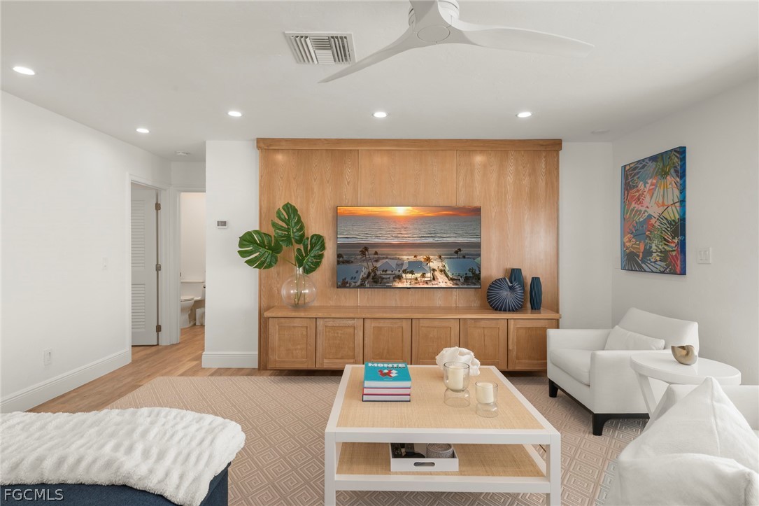 19 Beach Homes Captiva, FL 33924 - Photo 20 of 49 a living room with furniture and a potted plant