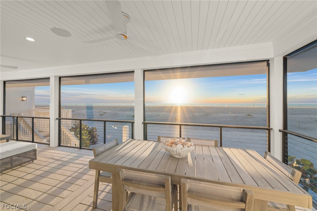 19 Beach Homes Captiva, FL 33924 - Photo 23 of 49 a bedroom with a bed and glass walk in closet