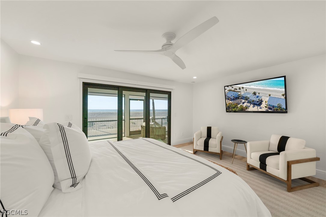 19 Beach Homes Captiva, FL 33924 - Photo 27 of 49 a bedroom with bed and a large window