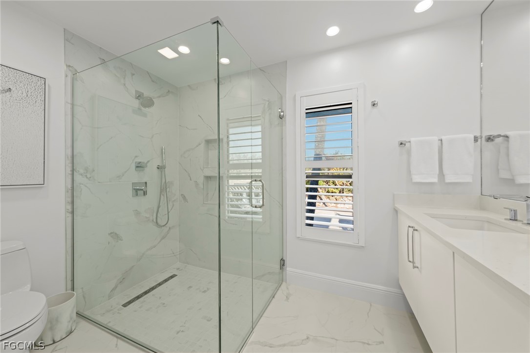 19 Beach Homes Captiva, FL 33924 - Photo 29 of 49 a bathroom with a shower sink vanity and toilet