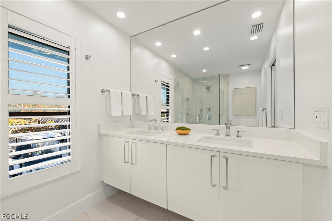 19 Beach Homes Captiva, FL 33924 - Photo 30 of 49 a view of double vanity and a mirror