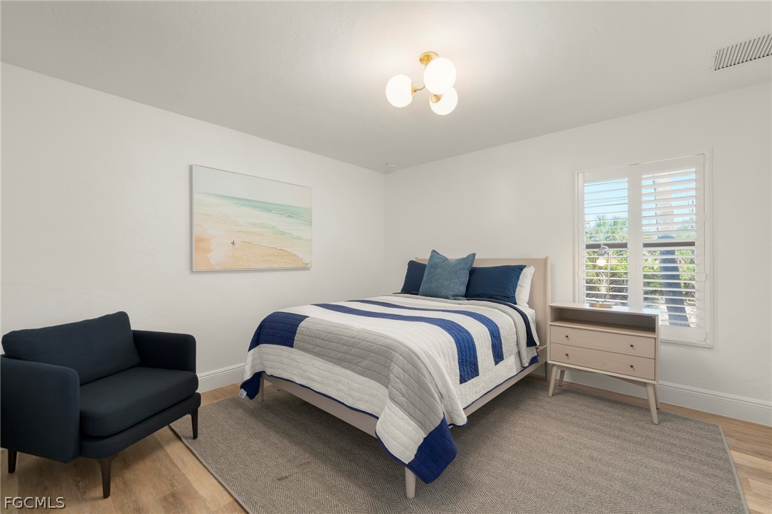 19 Beach Homes Captiva, FL 33924 - Photo 31 of 49 a bedroom with a bed couch and a window