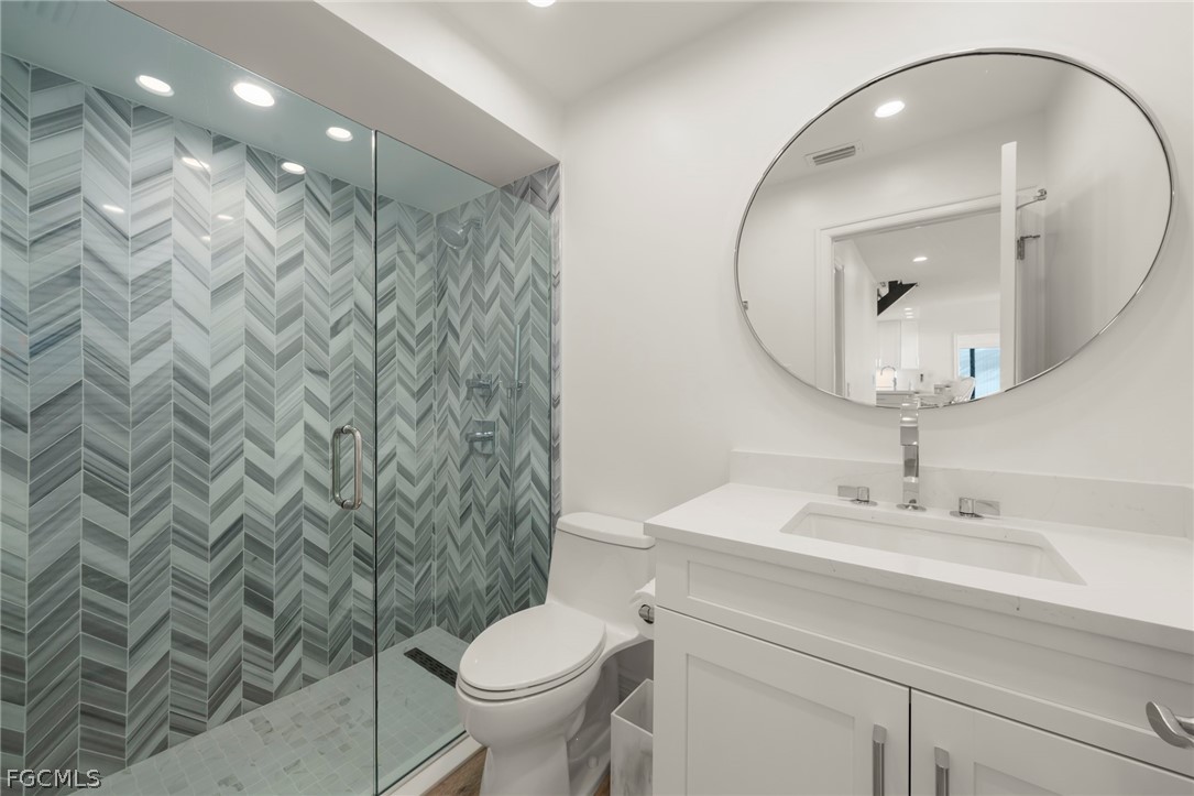 19 Beach Homes Captiva, FL 33924 - Photo 33 of 49 a bathroom with a sink a toilet and shower