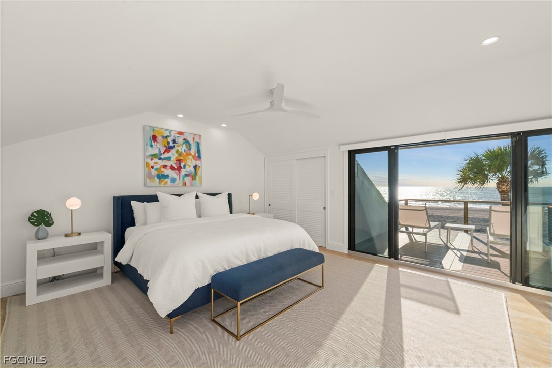 19 Beach Homes Captiva, FL 33924 - Photo 36 of 49 a bedroom with a bed and a large window with outer view