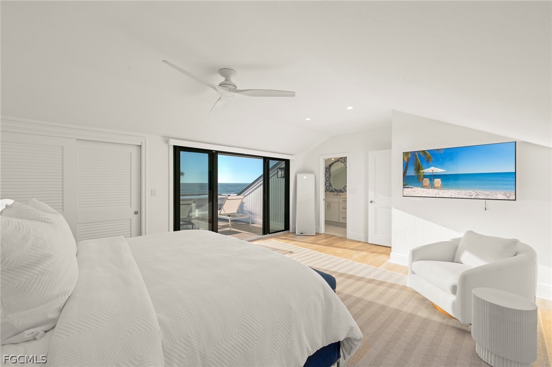 19 Beach Homes Captiva, FL 33924 - Photo 37 of 49 a bedroom with a large bed and a large window