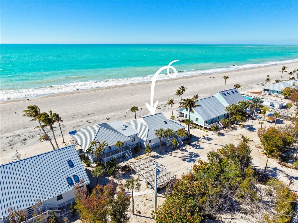 19 Beach Homes Captiva, FL 33924 - Photo 5 of 49 an aerial view of a beach with a yard