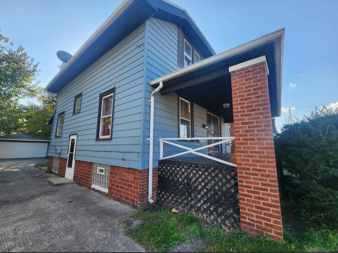 824 Merrill Street Hammond, IN 46320 - Photo 3 of 5 a front view of a house with plants
