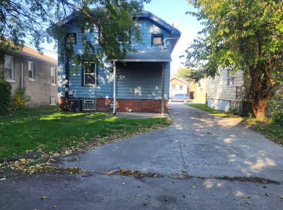824 Merrill Street Hammond, IN 46320 - Photo 4 of 5 a front view of a house with a yard and garage