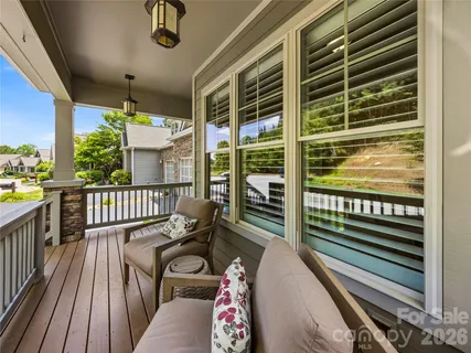 a balcony with wooden floor