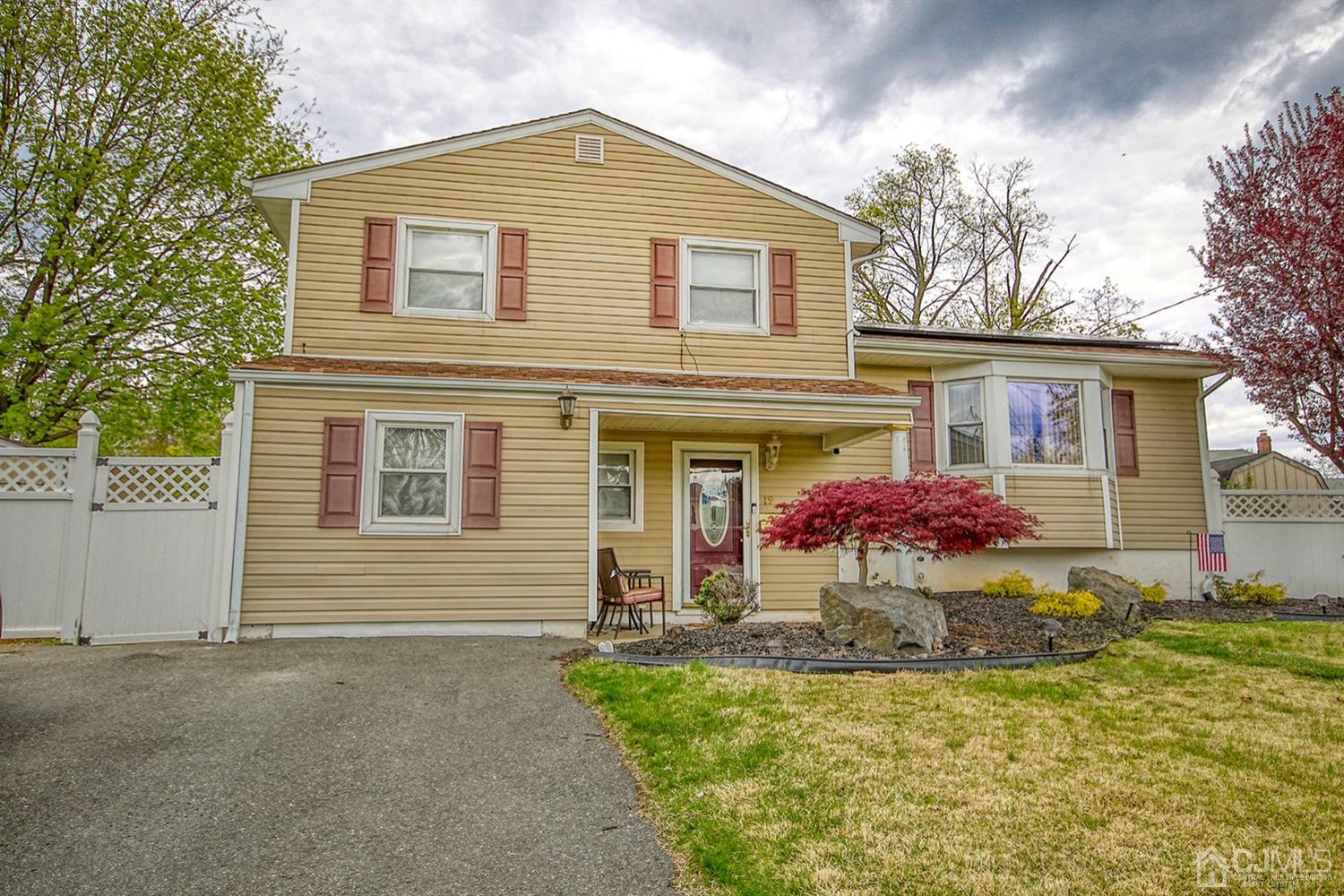 19 Sulliman Road Edison, NJ 08817 - Photo 1 of 22 a front view of house with yard
