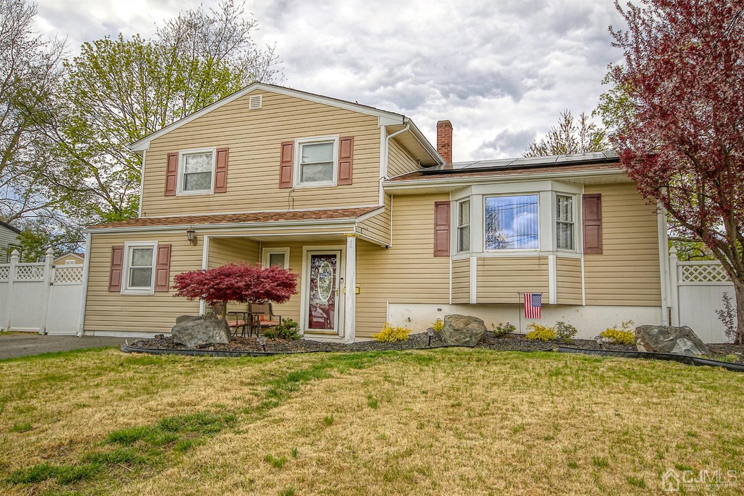 19 Sulliman Road Edison, NJ 08817 - Photo 2 of 22 a front view of house with yard