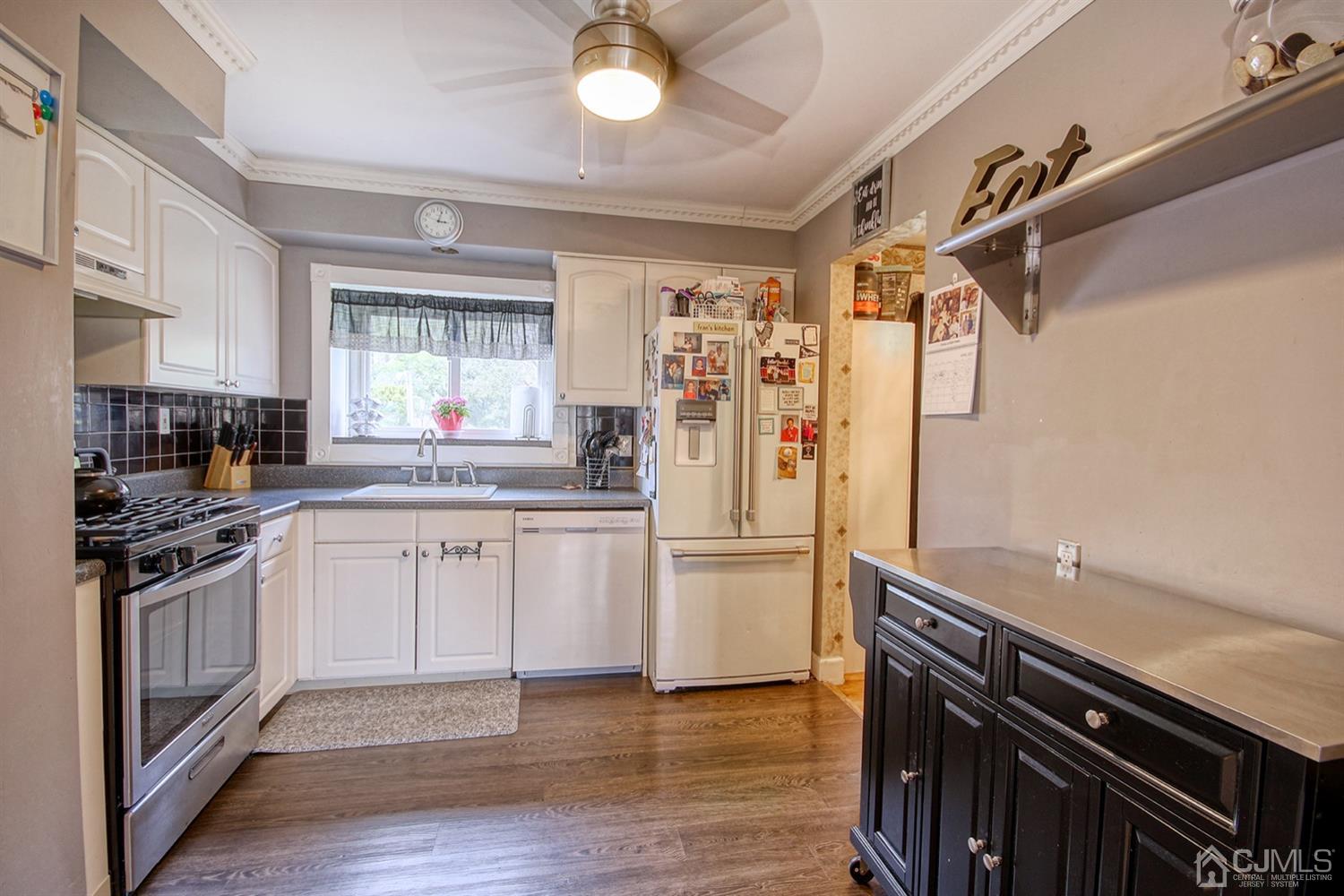 19 Sulliman Road Edison, NJ 08817 - Photo 12 of 22 a kitchen with a refrigerator and a sink