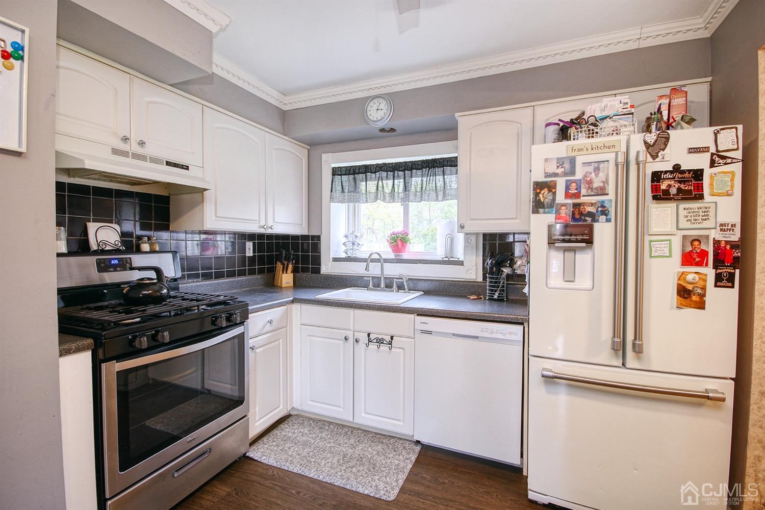 19 Sulliman Road Edison, NJ 08817 - Photo 13 of 22 a kitchen with stainless steel appliances granite countertop a refrigerator and a stove top oven