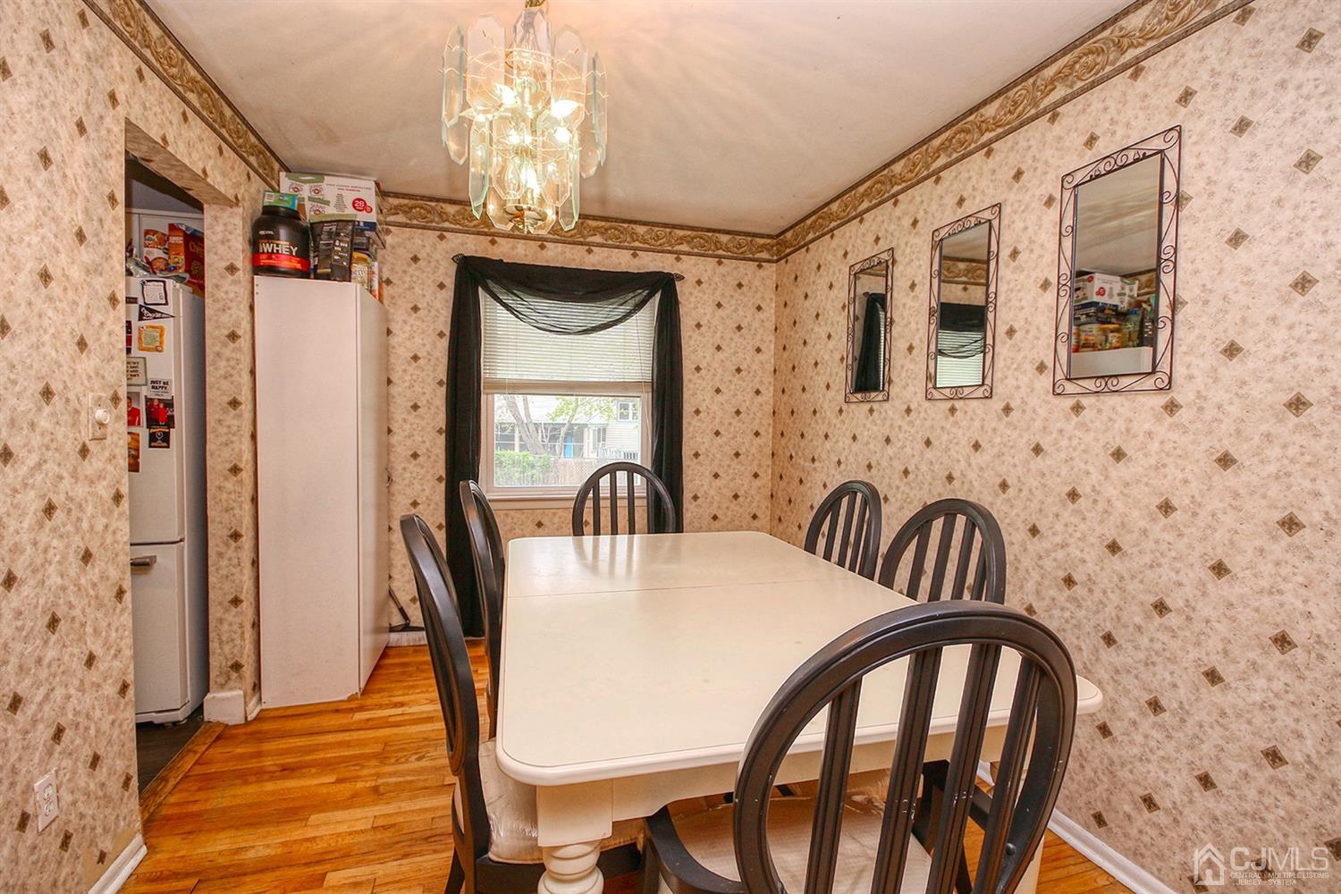 19 Sulliman Road Edison, NJ 08817 - Photo 14 of 22 a view of a dining room with furniture window and wooden floor