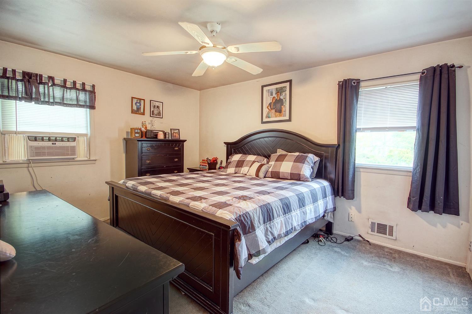 19 Sulliman Road Edison, NJ 08817 - Photo 15 of 22 a bedroom with a bed and a window