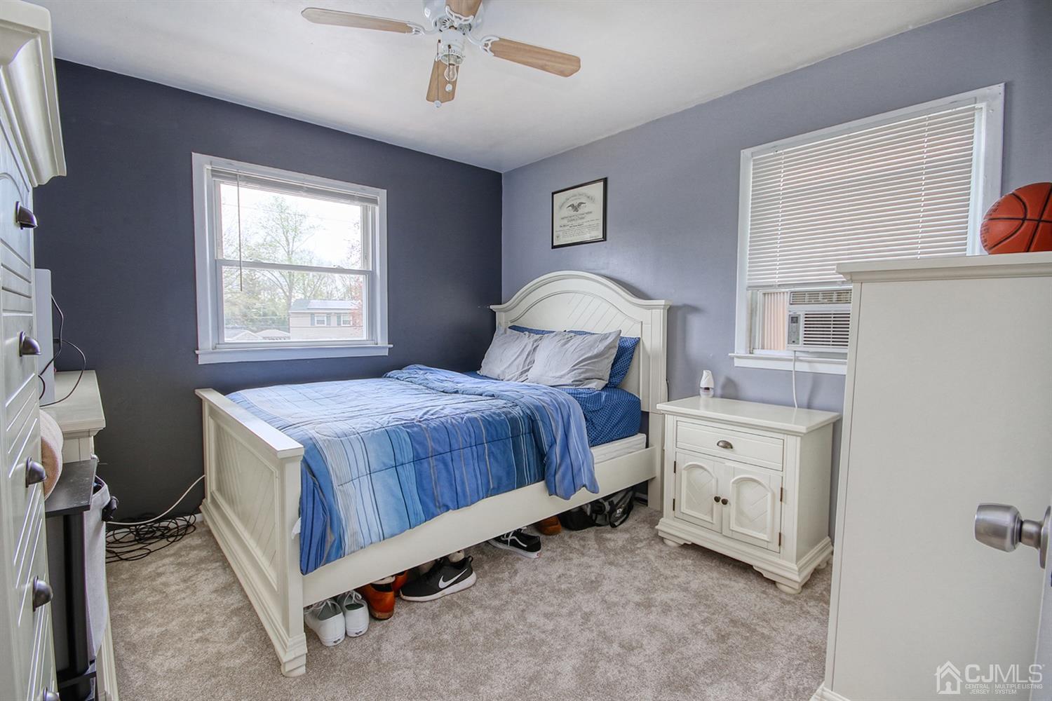 19 Sulliman Road Edison, NJ 08817 - Photo 16 of 22 a bedroom with a bed and a window