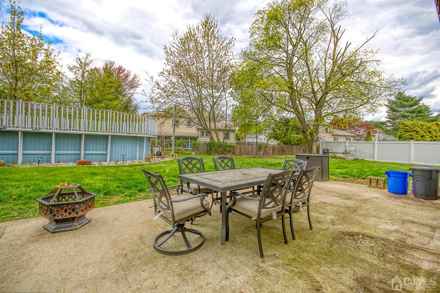 19 Sulliman Road Edison, NJ 08817 - Photo 20 of 22 a view of a chair and table in backyard